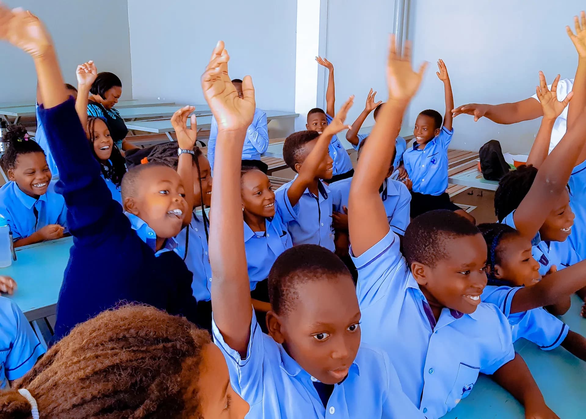 Learners taking part in a lively classroom activity.
